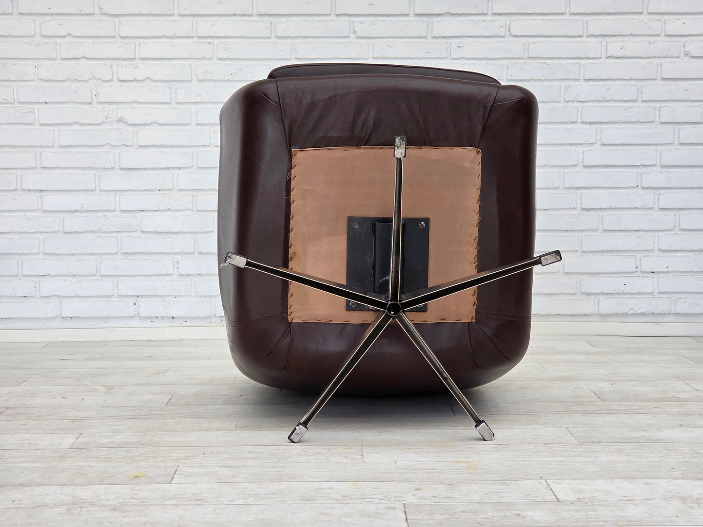 1970s, set of two swivel lounge chairs with footstool, leather.