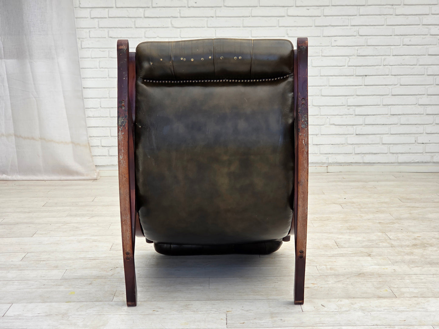 1950s, Chesterfield rocking chair, original green furniture leather, teak wood.