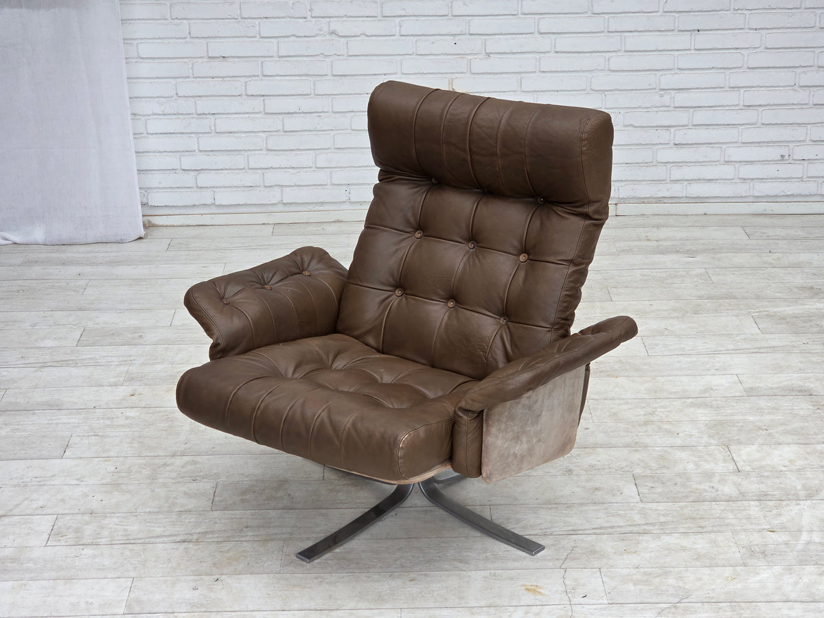 1970s, Danish swivel armchair with footstool, leather, stainless steel.