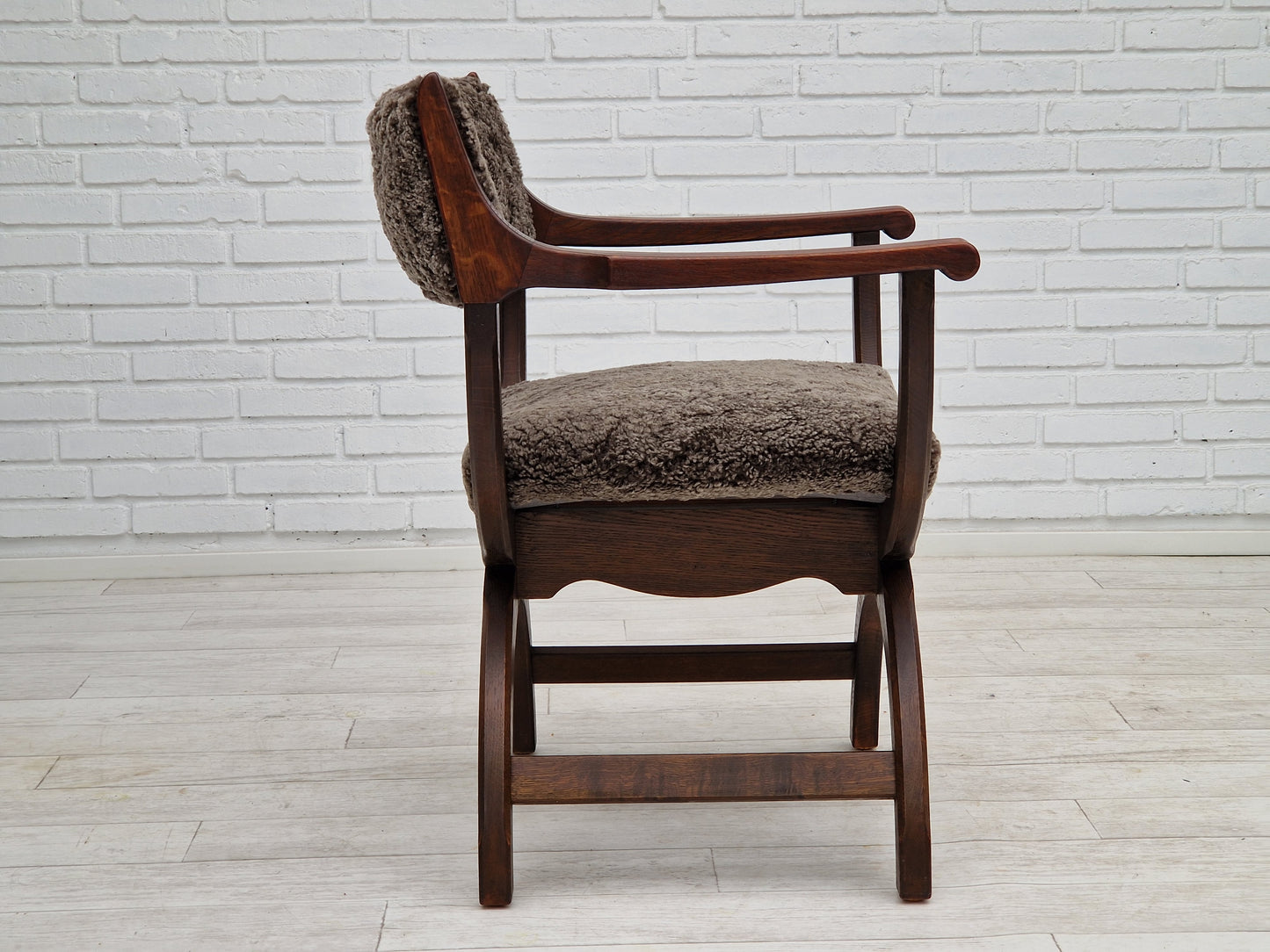 1960s, Danish design by Henning Kjærnulf, chair model "Kurul", sheepskin, dark oak.