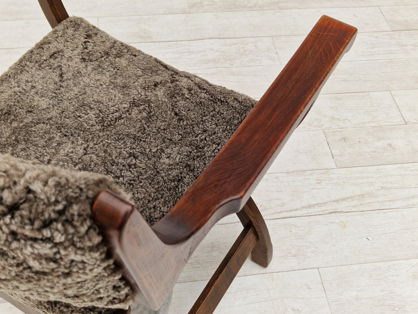 1960s, Danish design by Henning Kjærnulf, chair model "Kurul", sheepskin, dark oak.