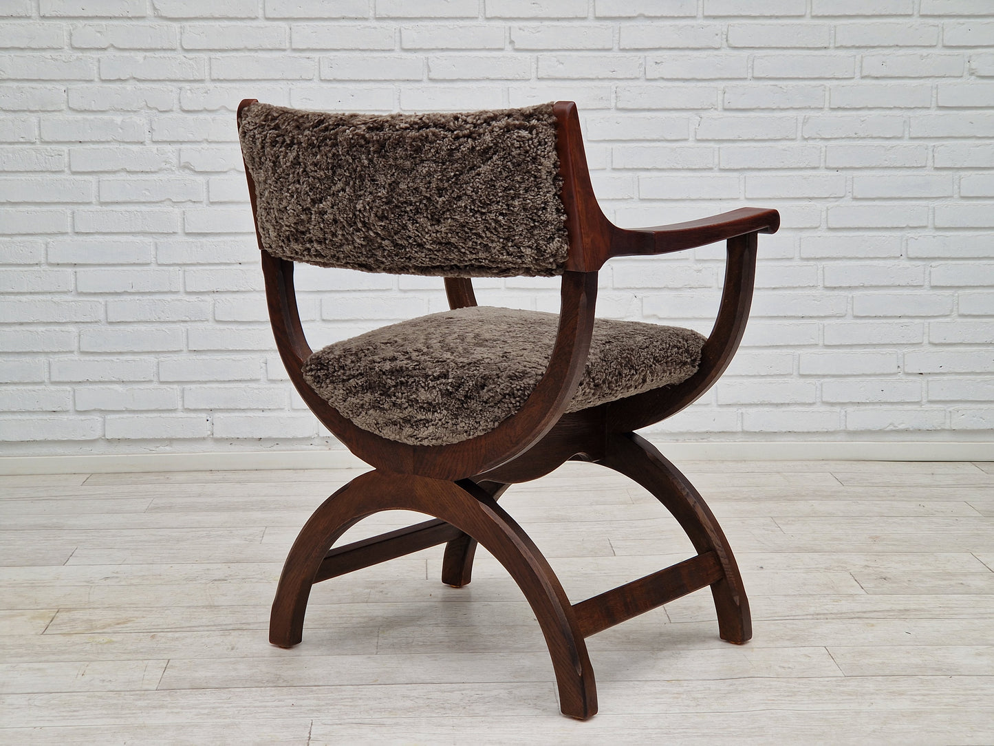 1960s, Danish design by Henning Kjærnulf, chair model "Kurul", sheepskin, dark oak.