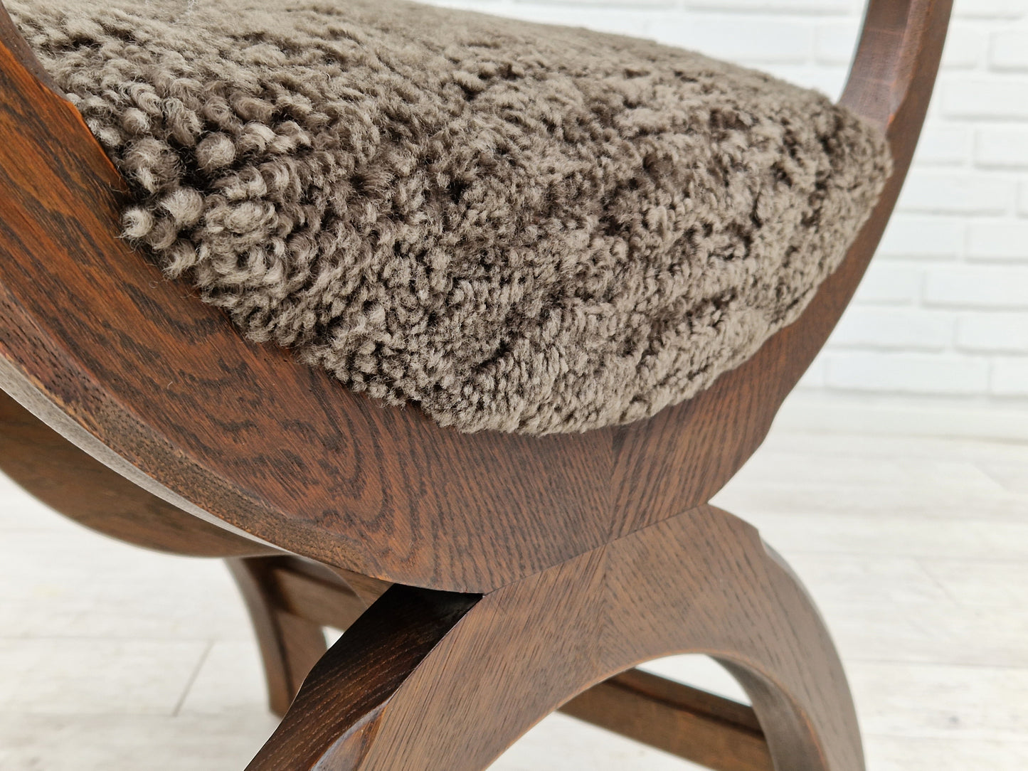 1960s, Danish design by Henning Kjærnulf, chair model "Kurul", sheepskin, dark oak.