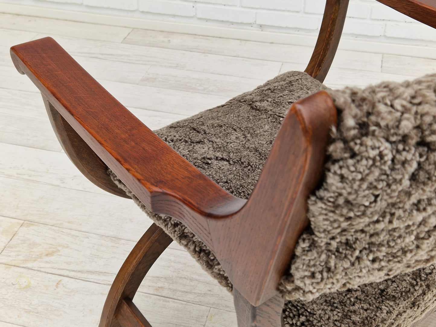 1960s, Danish design by Henning Kjærnulf, chair model "Kurul", sheepskin, dark oak.