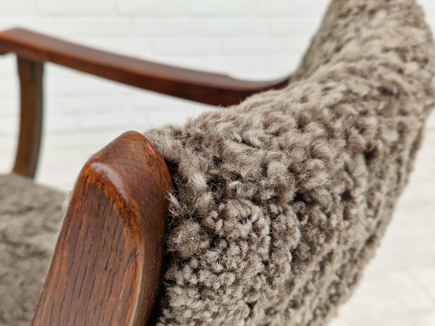 1960s, Danish design by Henning Kjærnulf, chair model "Kurul", sheepskin, dark oak.