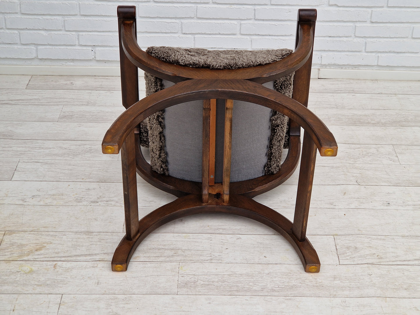 1960s, Danish design by Henning Kjærnulf, chair model "Kurul", sheepskin, dark oak.