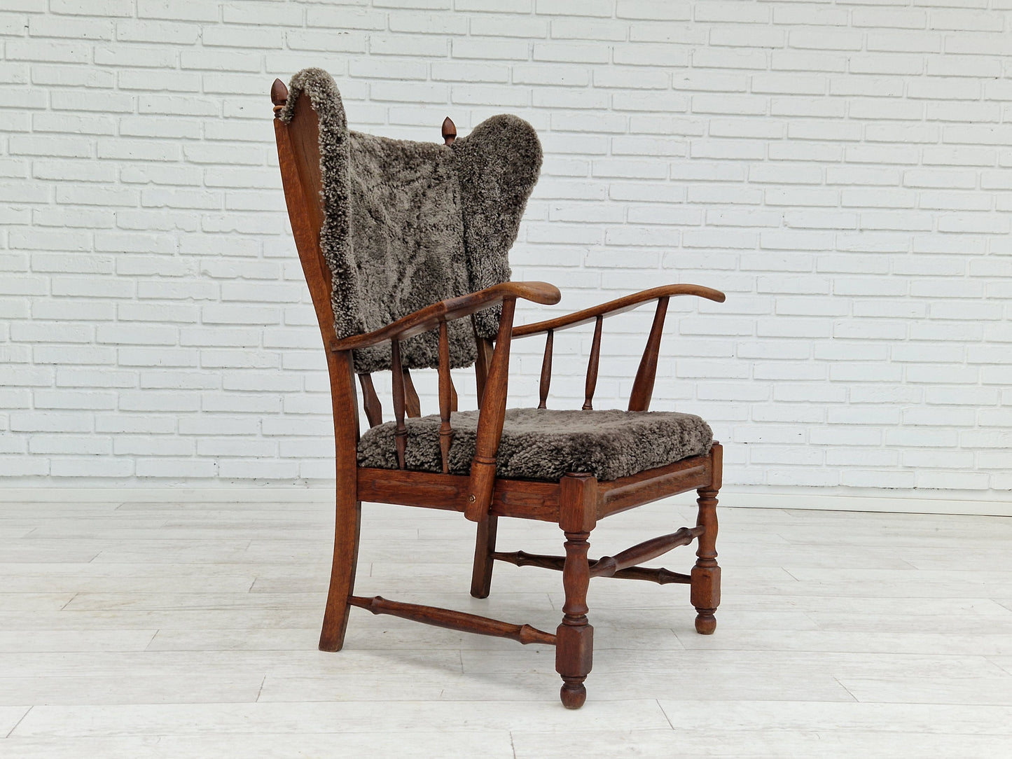 1960s, Danish design, renovated-reupholstered high-back ear flap chair, sheepskin, oak wood