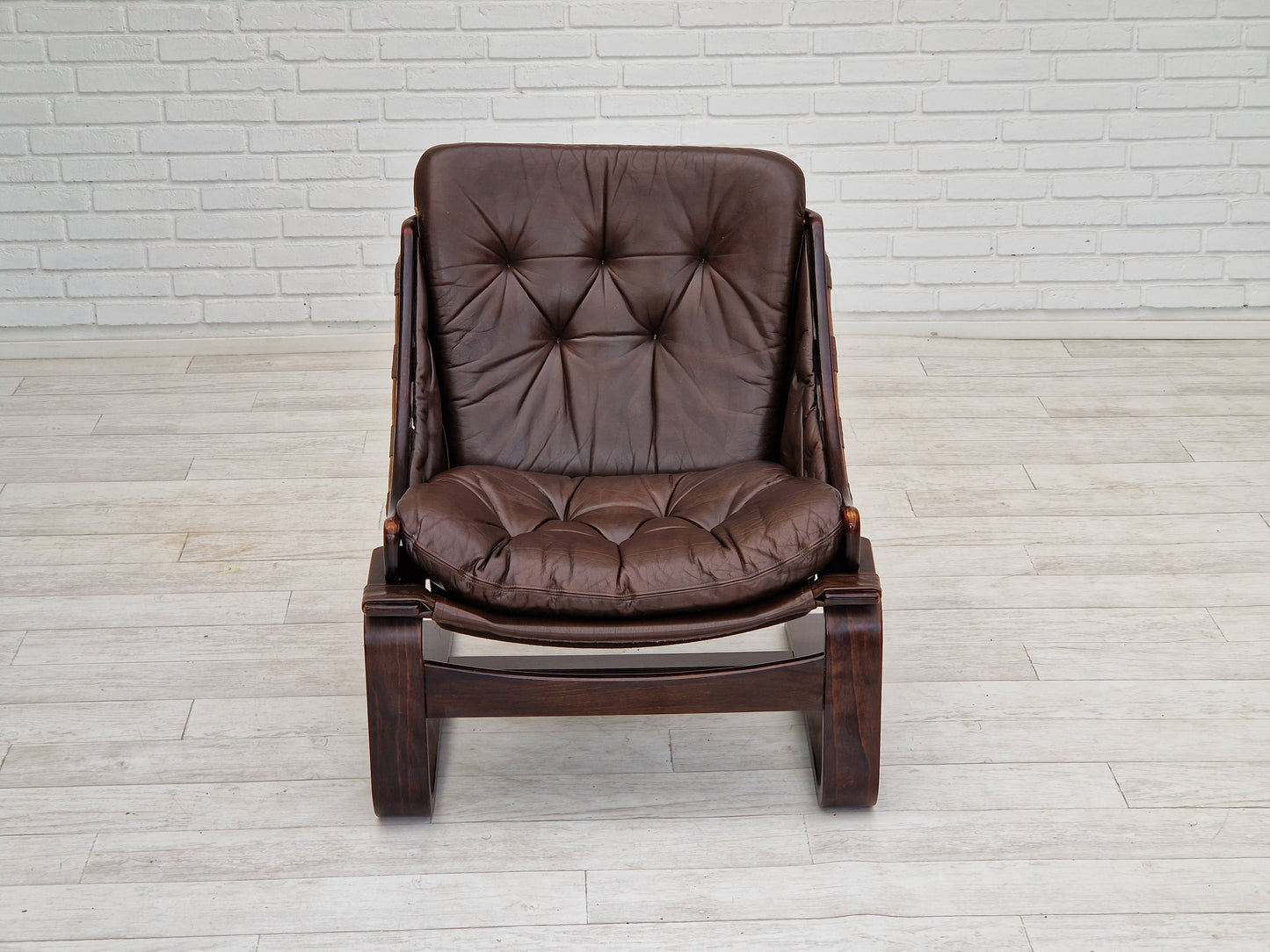 1970s, brown leather lounge chair by Ake Fribytter for Nelo Sweden.