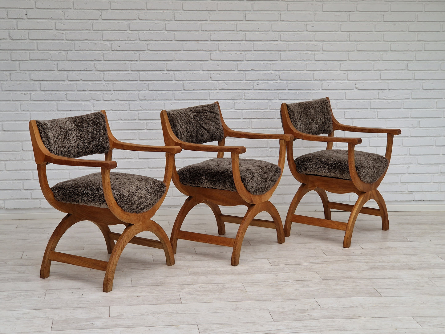 1960s, Danish design by Henning Kjærnulf, chair model "Kurul", sheepskin, oak wood.