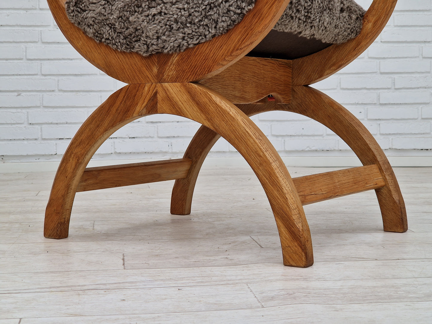 1960s, Danish design by Henning Kjærnulf, chair model "Kurul", sheepskin, oak wood.