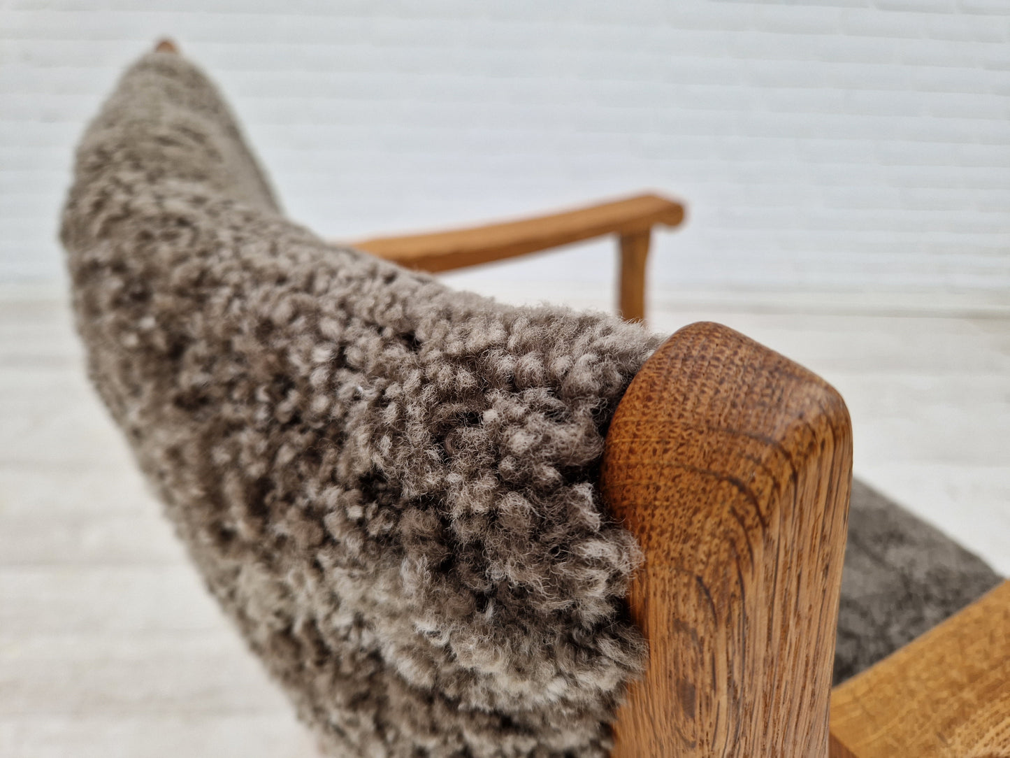 1960s, Danish design by Henning Kjærnulf, chair model "Kurul", sheepskin, oak wood.