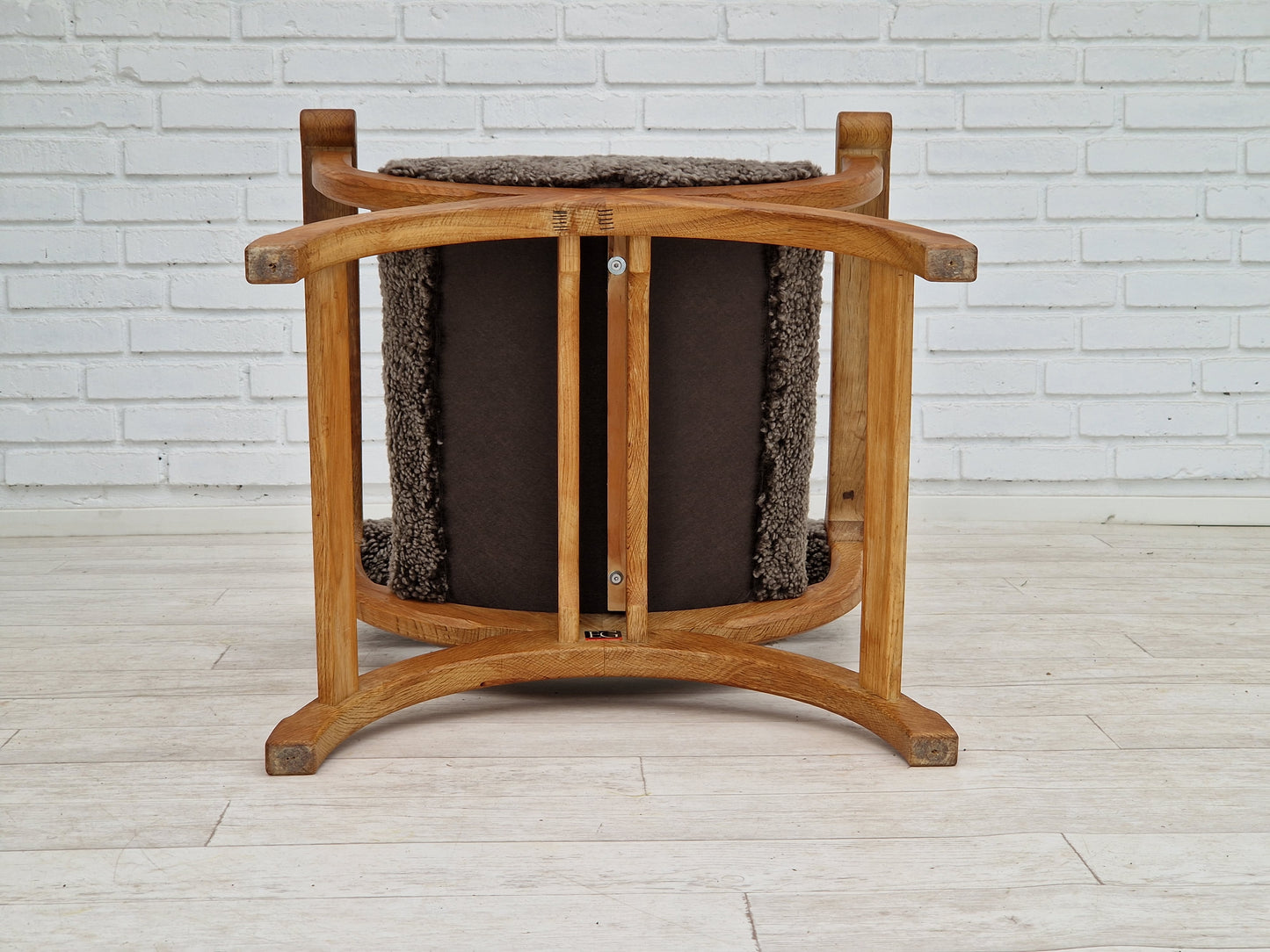 1960s, Danish design by Henning Kjærnulf, chair model "Kurul", sheepskin, oak wood.