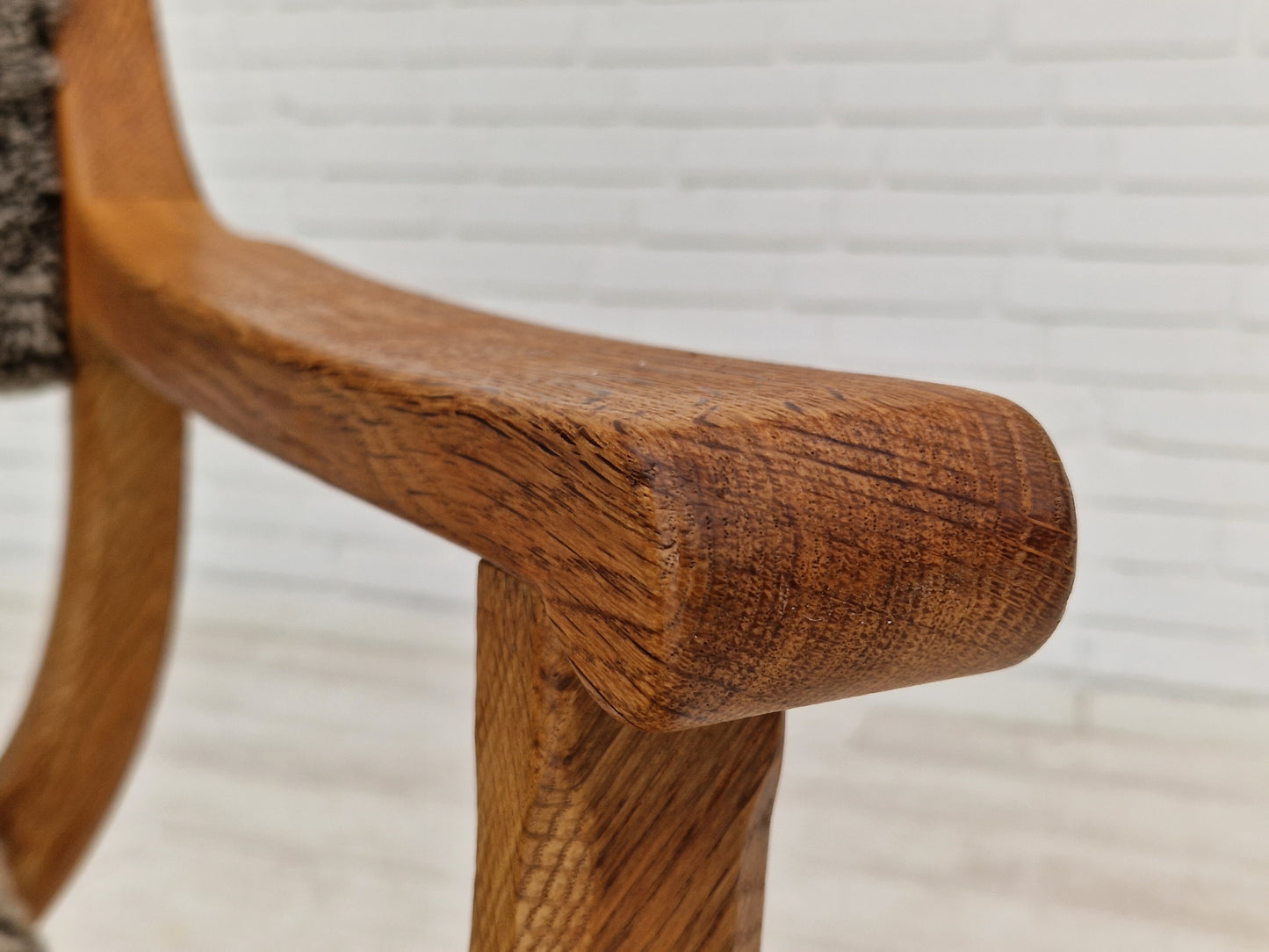 1960s, Danish design by Henning Kjærnulf, chair model "Kurul", sheepskin, oak wood.