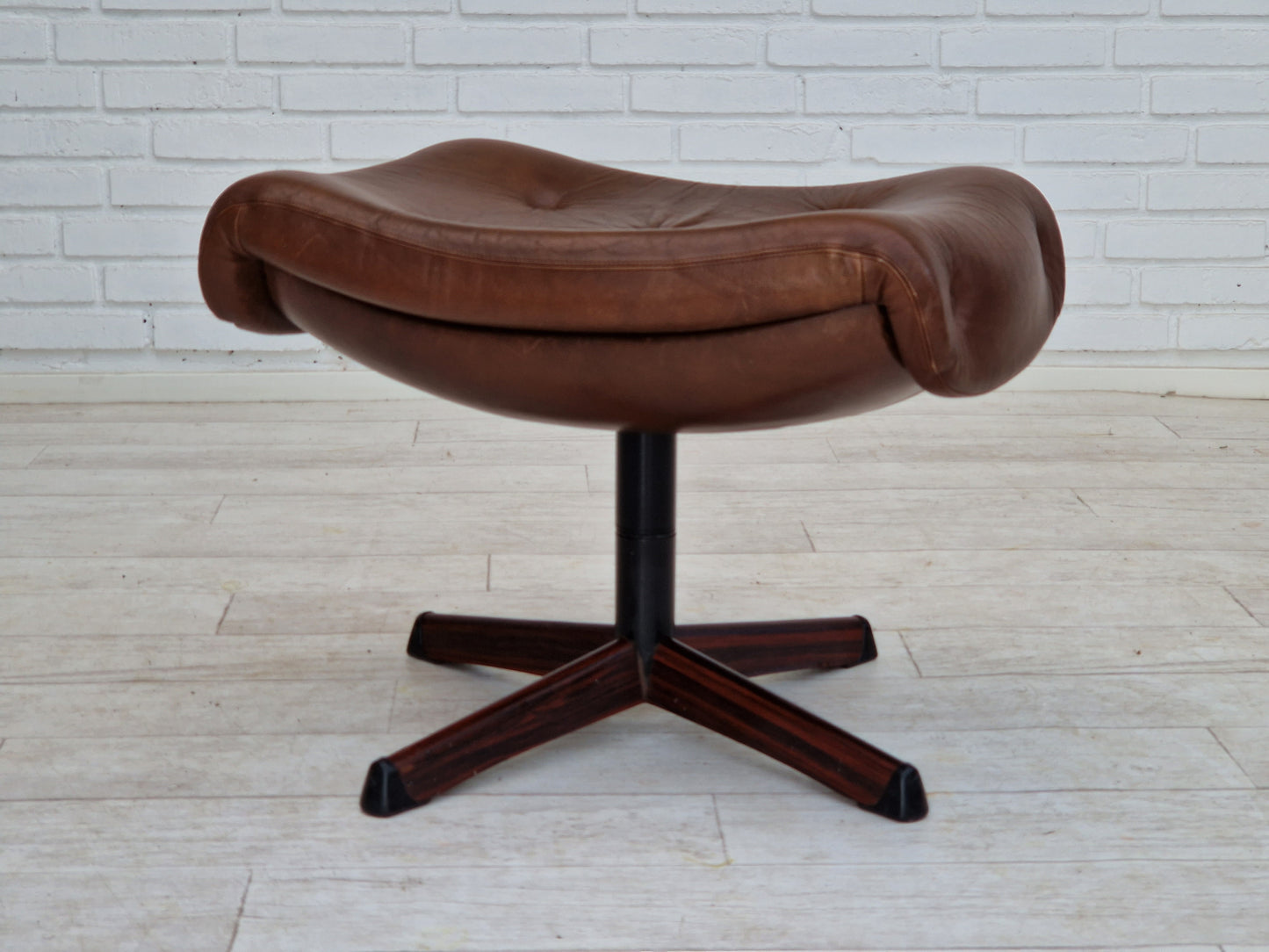 1970s, Swedish design by Göte Möbler Nässjö, swivel footstool in brown leather.