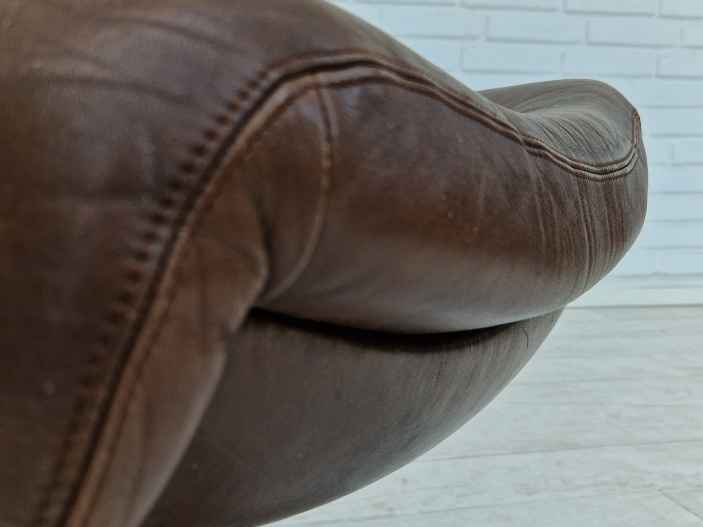 1970s, Swedish design by Göte Möbler Nässjö, swivel footstool in brown leather.