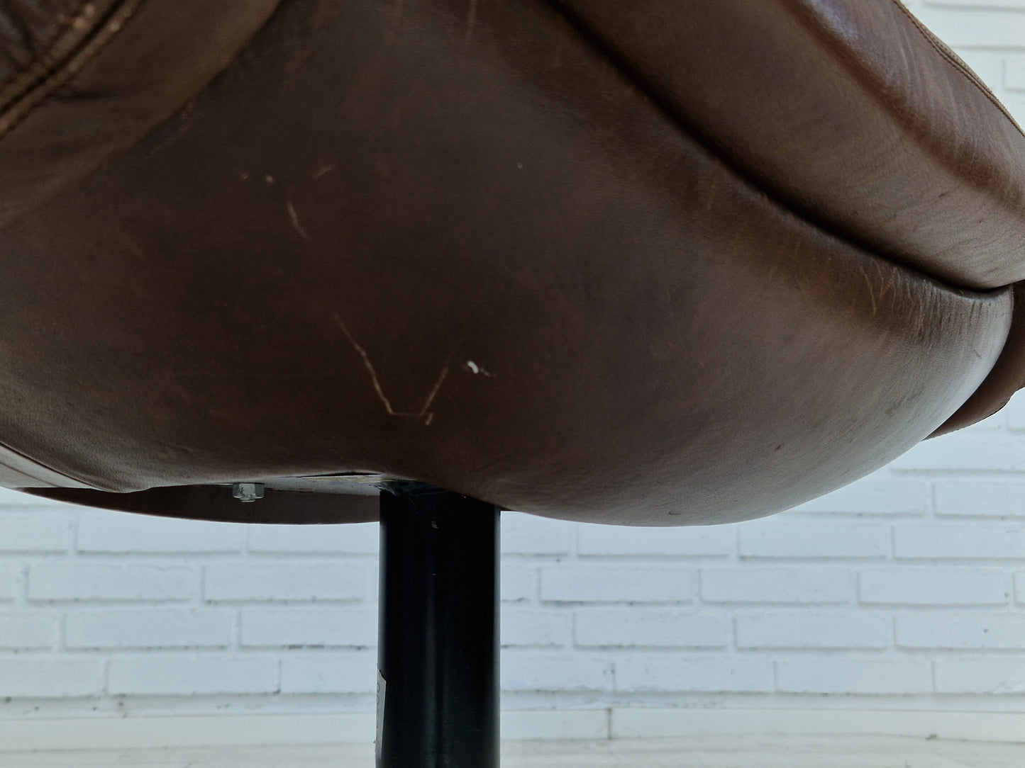 1970s, Swedish design by Göte Möbler Nässjö, swivel footstool in brown leather.