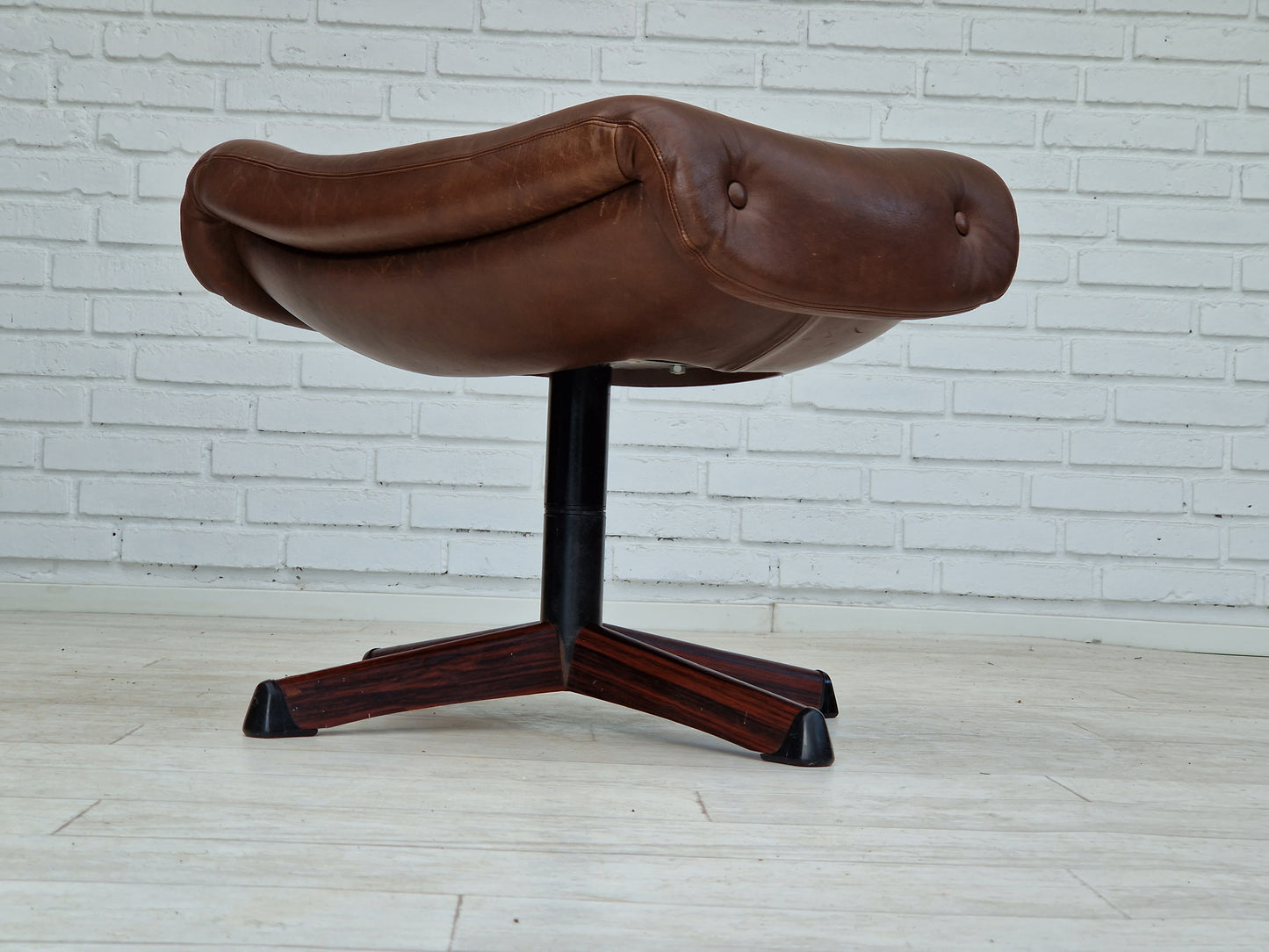 1970s, Swedish design by Göte Möbler Nässjö, swivel footstool in brown leather.