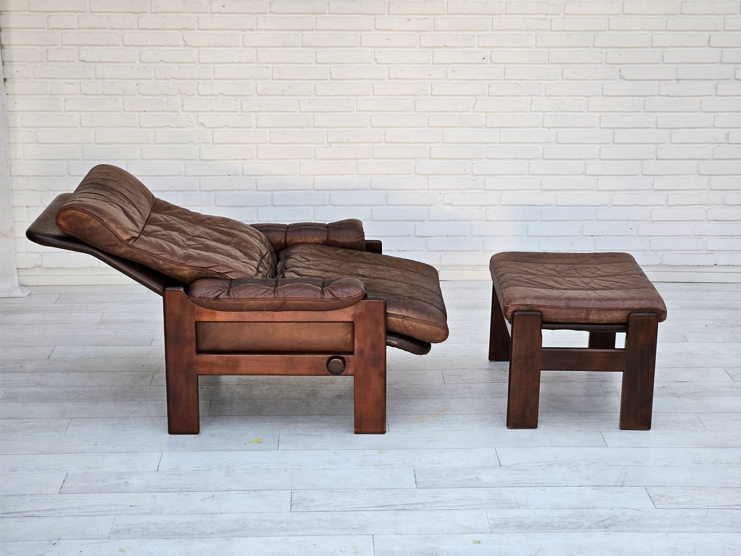 1970s, Danish adjustable lounge chair with footstool, brown leather, by Skippers Møbler.