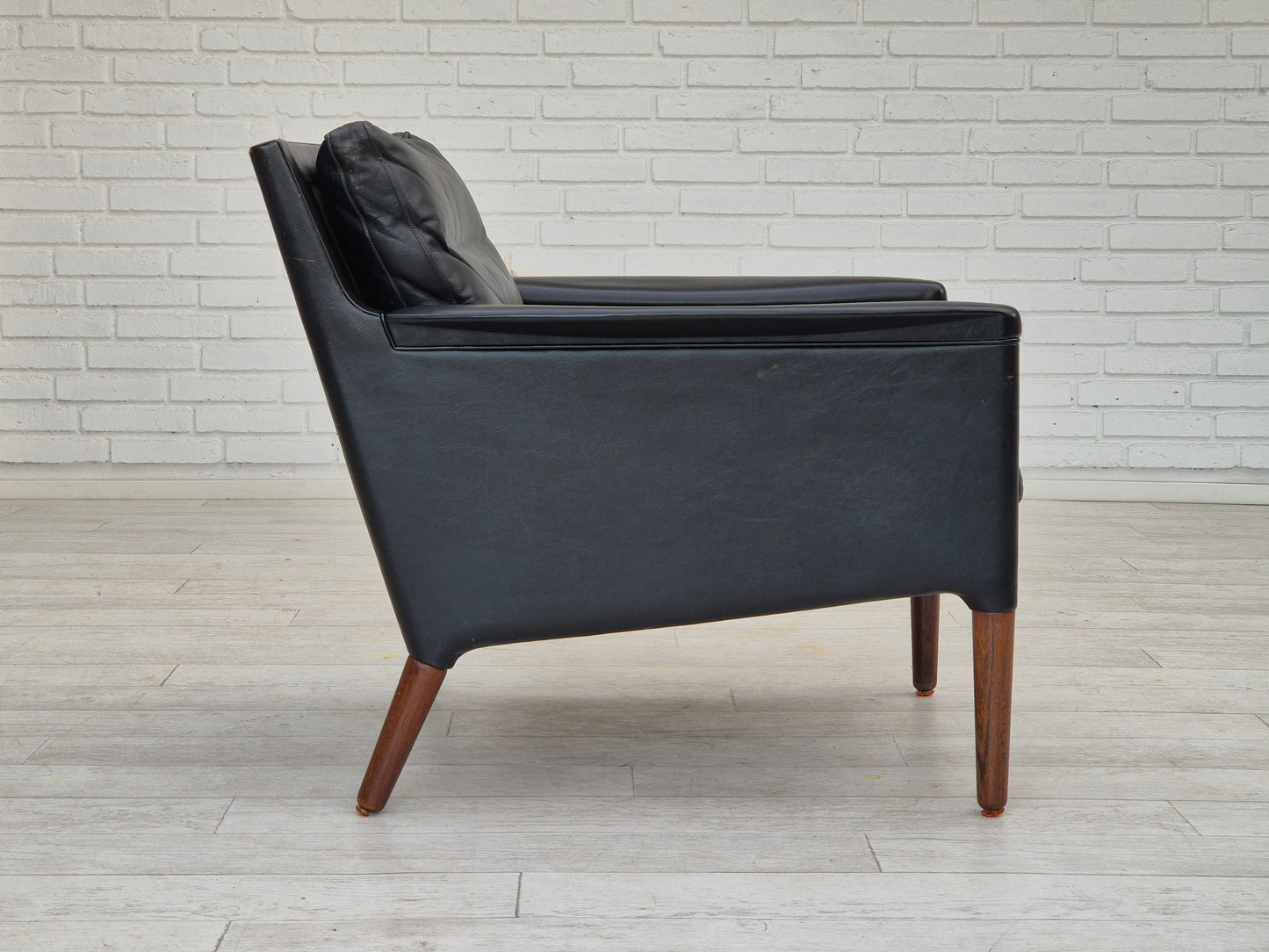 1960s, Danish design by Kurt Østervig, lounge chair model 55, leather, rosewood legs, original condition.