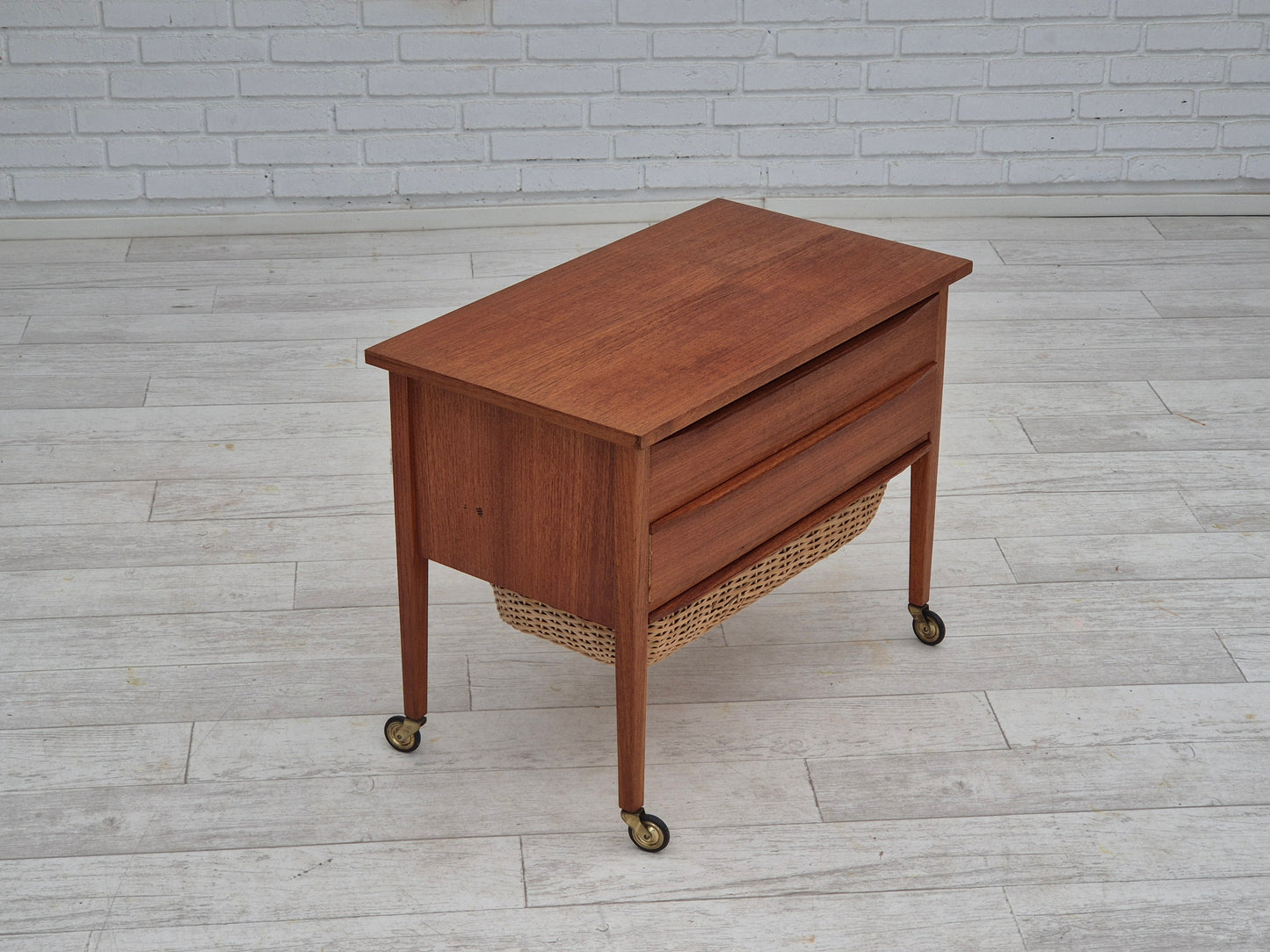 1970s, Danish side chest of drawers, teak wood, rattan, brass wheels, original condition.