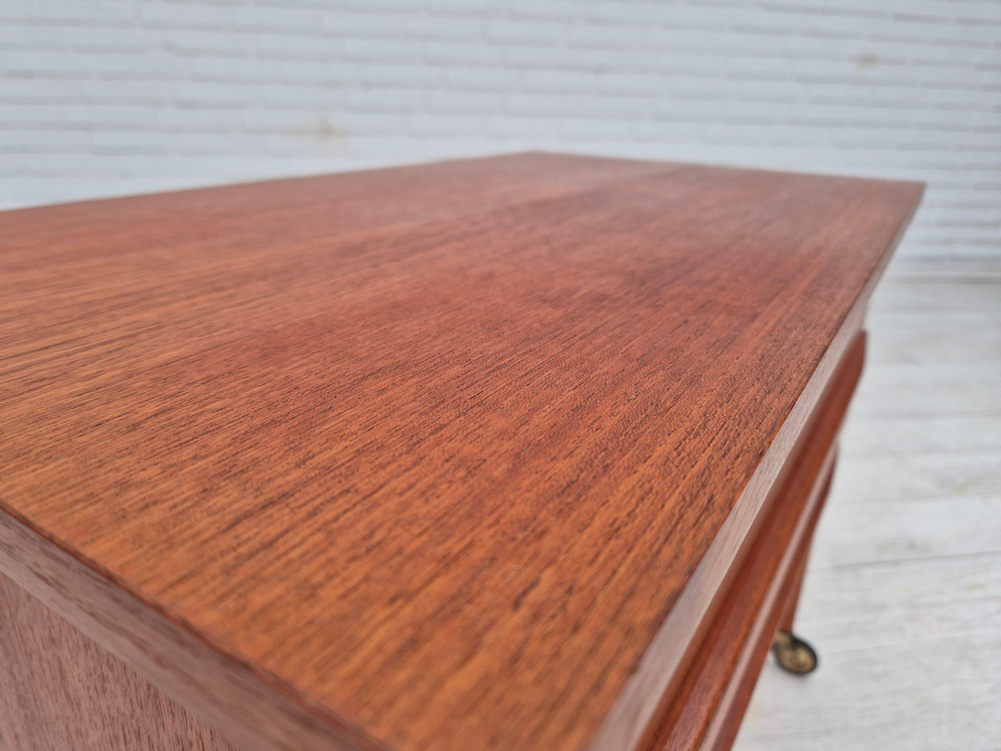 1970s, Danish side chest of drawers, teak wood, rattan, brass wheels, original condition.