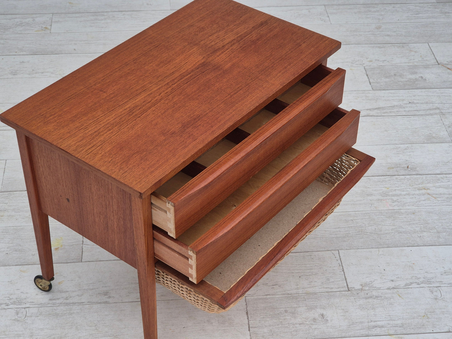 1970s, Danish side chest of drawers, teak wood, rattan, brass wheels, original condition.