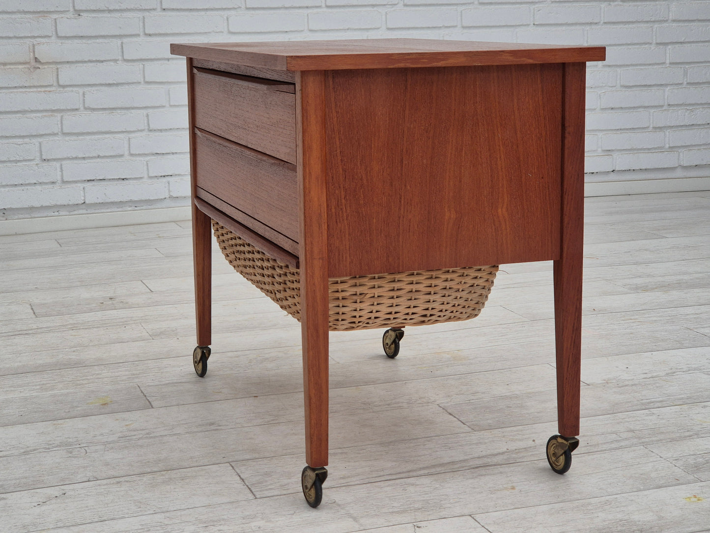 1970s, Danish side chest of drawers, teak wood, rattan, brass wheels, original condition.