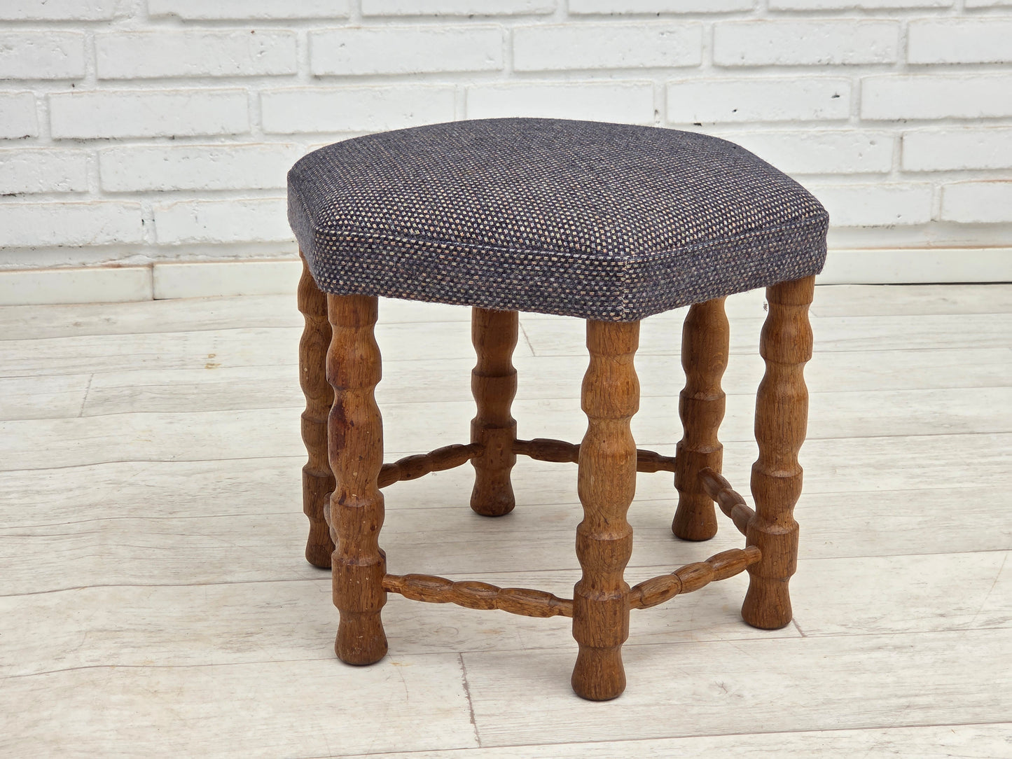 1970s, highback Danish armchair with footstool, furniture wool fabric, solid oak wood.