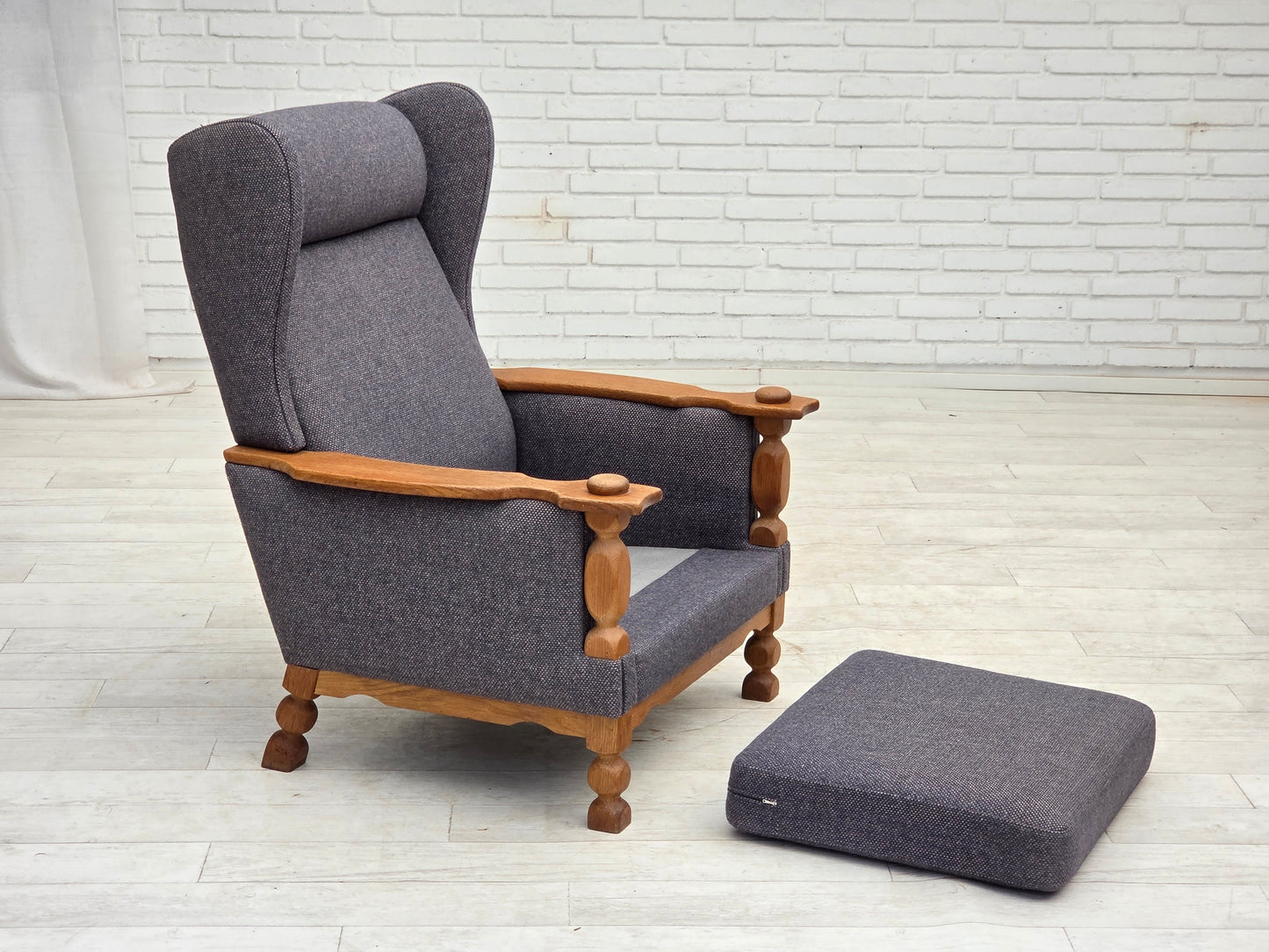1970s, highback Danish armchair with footstool, furniture wool fabric, solid oak wood.