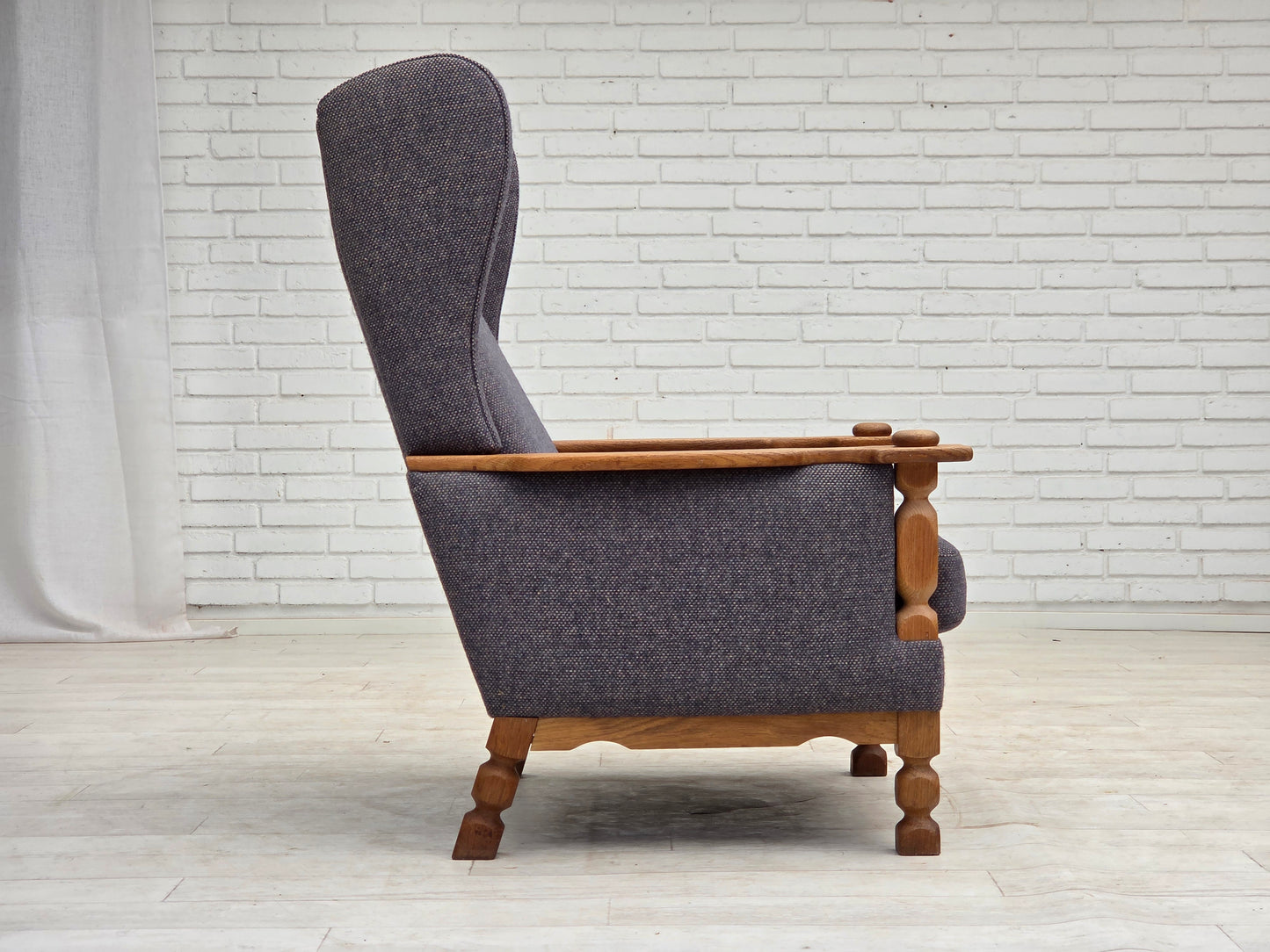 1970s, highback Danish armchair with footstool, furniture wool fabric, solid oak wood.