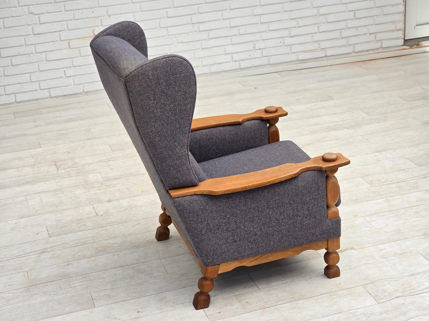 1970s, highback Danish armchair with footstool, furniture wool fabric, solid oak wood.