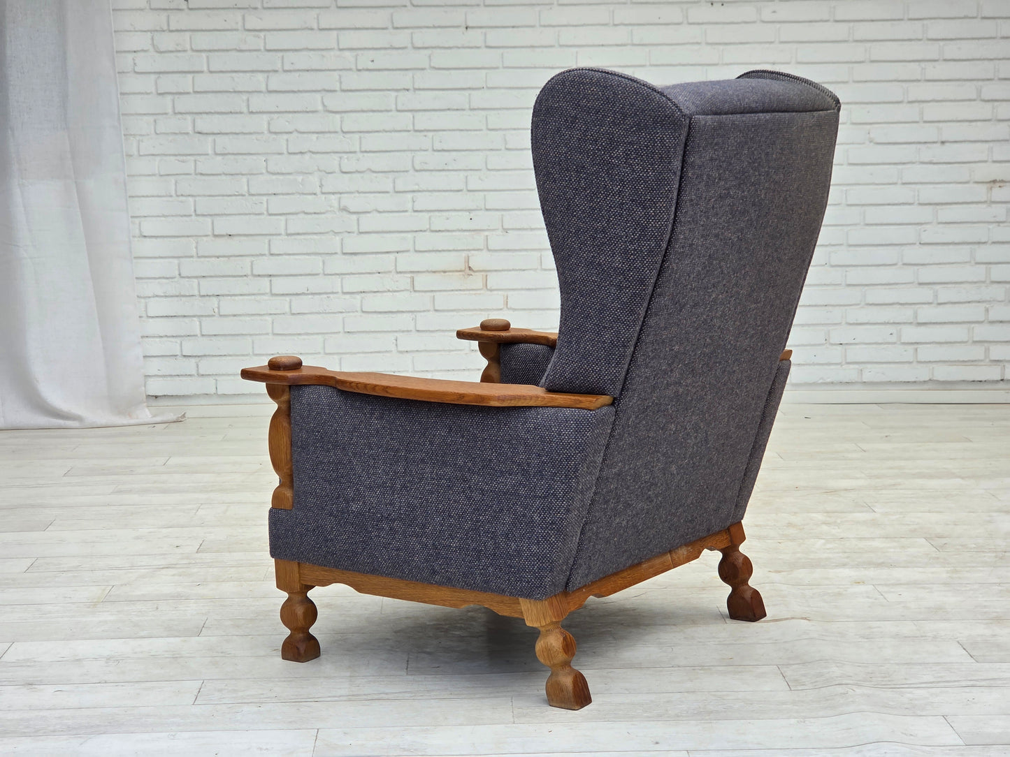 1970s, highback Danish armchair with footstool, furniture wool fabric, solid oak wood.