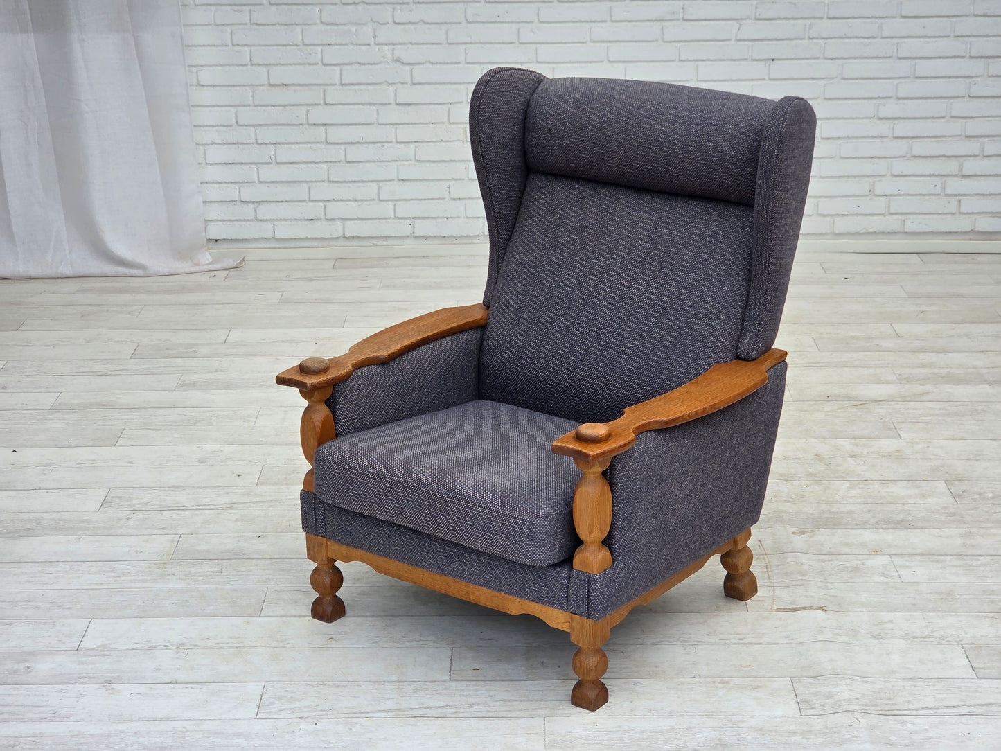 1970s, highback Danish armchair with footstool, furniture wool fabric, solid oak wood.