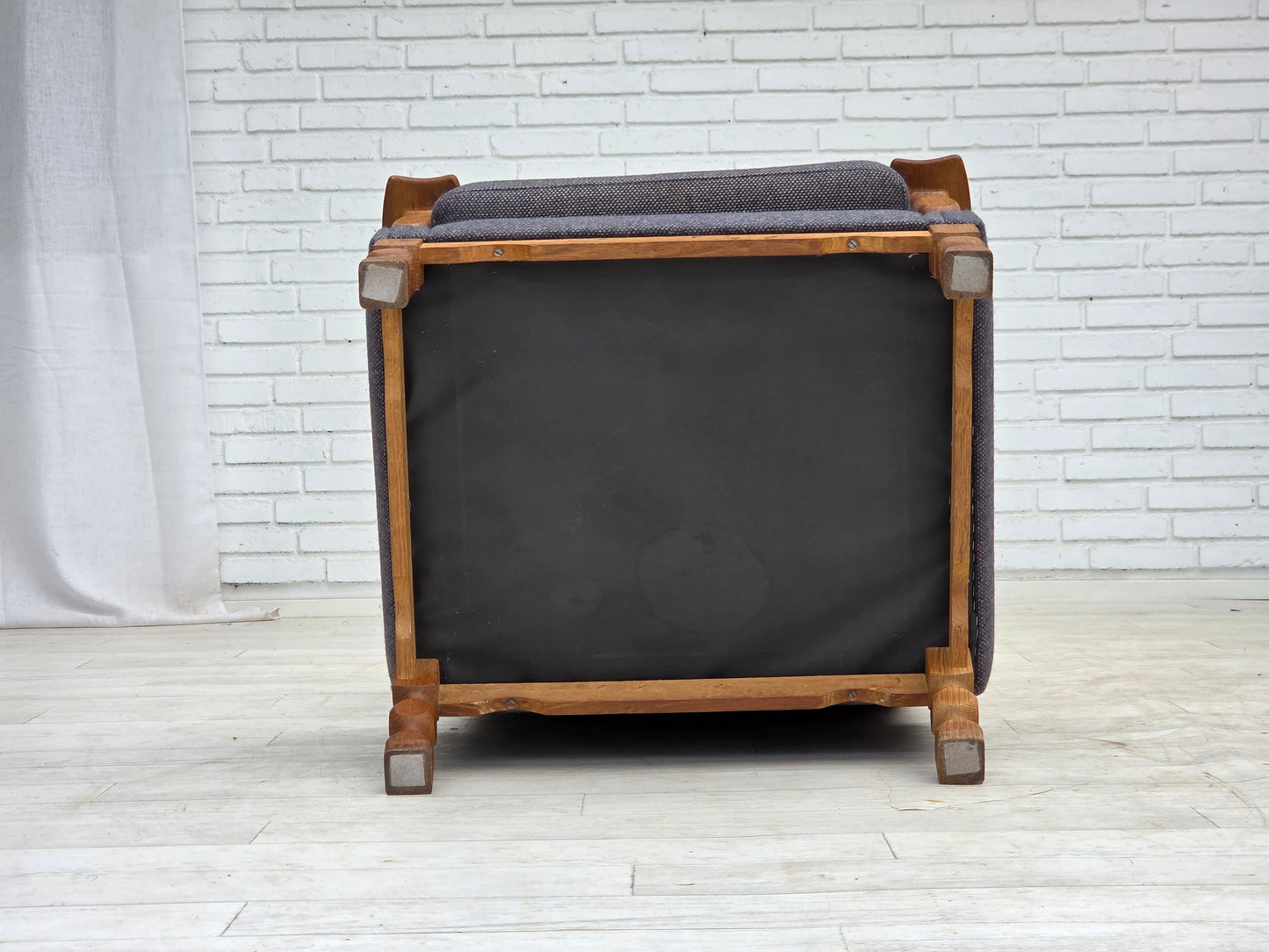 1970s, highback Danish armchair with footstool, furniture wool fabric, solid oak wood.