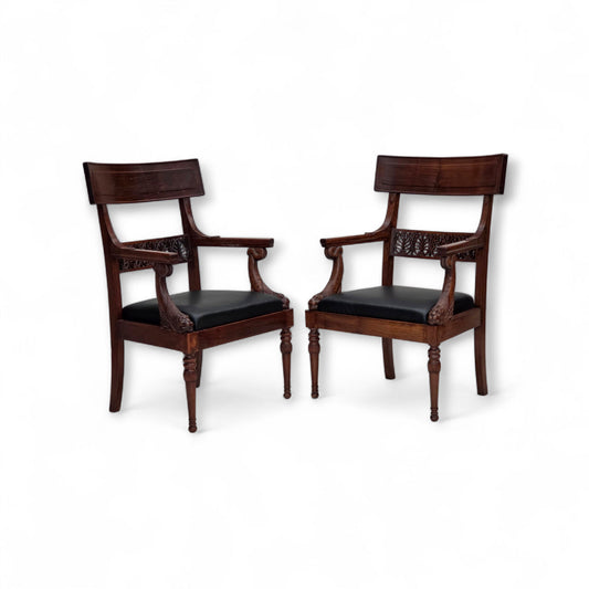 1920-30s, set of 2 armchairs, design after Georges Jacob, carved teak wood, leather, reupholstered.