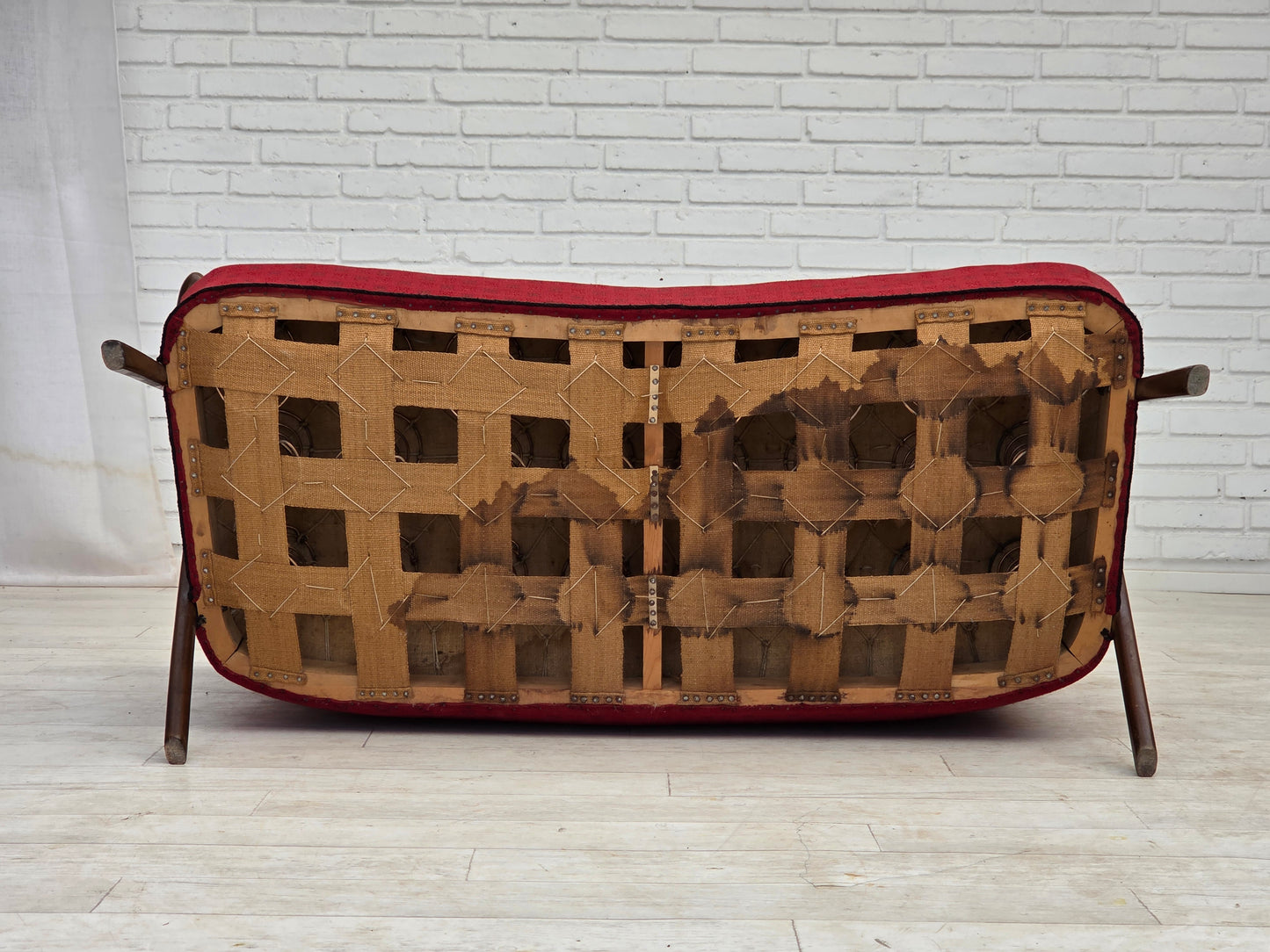 1960s, Danish 2-seater sofa, red furniture fabric, beech wood legs and armrests.
