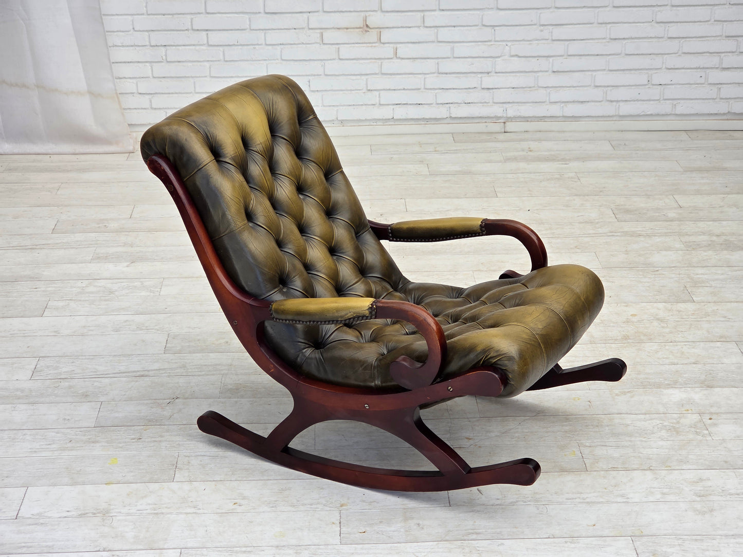 1950s, Chesterfield rocking chair, original green furniture leather, teak wood.