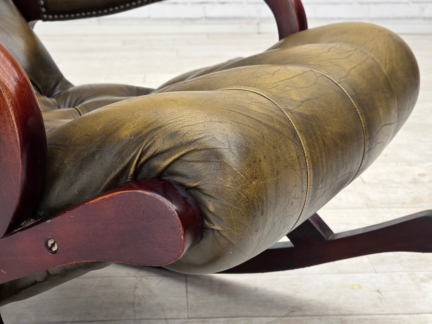 1950s, Chesterfield rocking chair, original green furniture leather, teak wood.