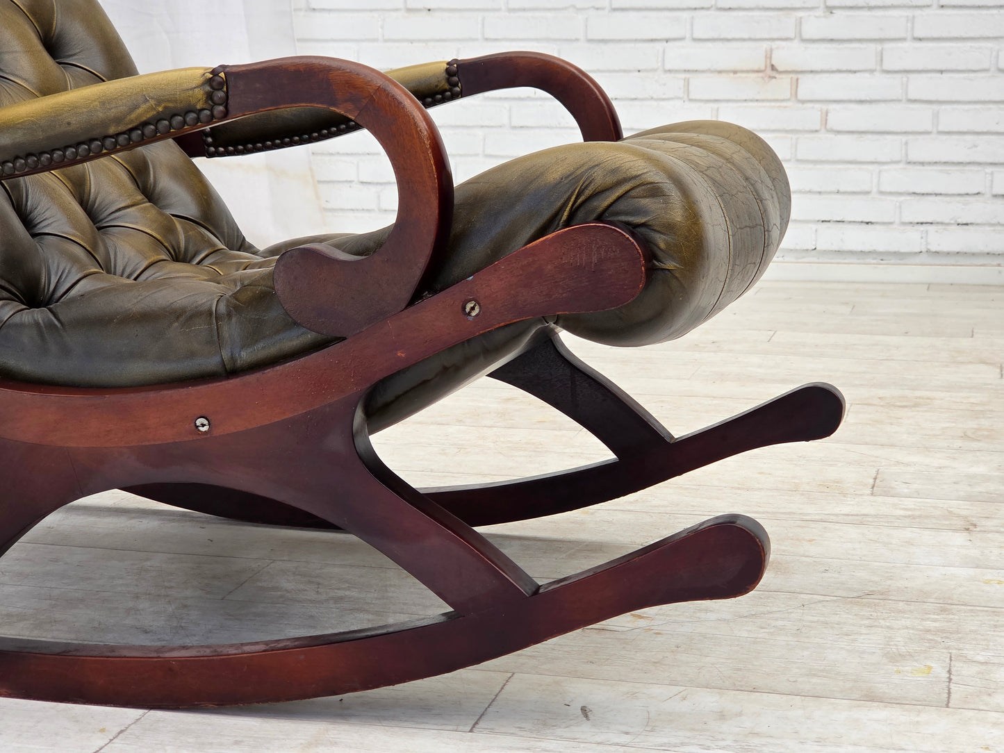 1950s, Chesterfield rocking chair, original green furniture leather, teak wood.