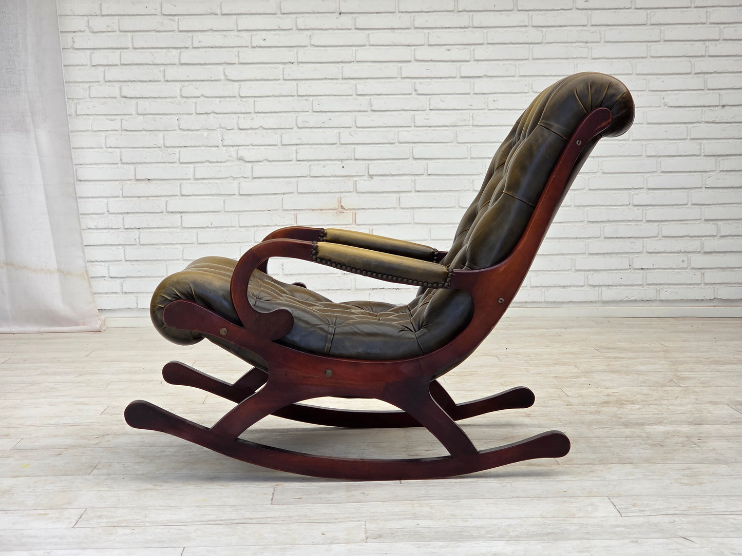 1950s, Chesterfield rocking chair, original green furniture leather, teak wood.