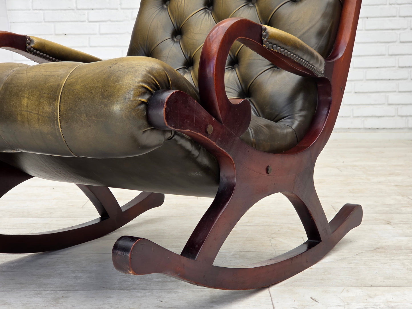 1950s, Chesterfield rocking chair, original green furniture leather, teak wood.