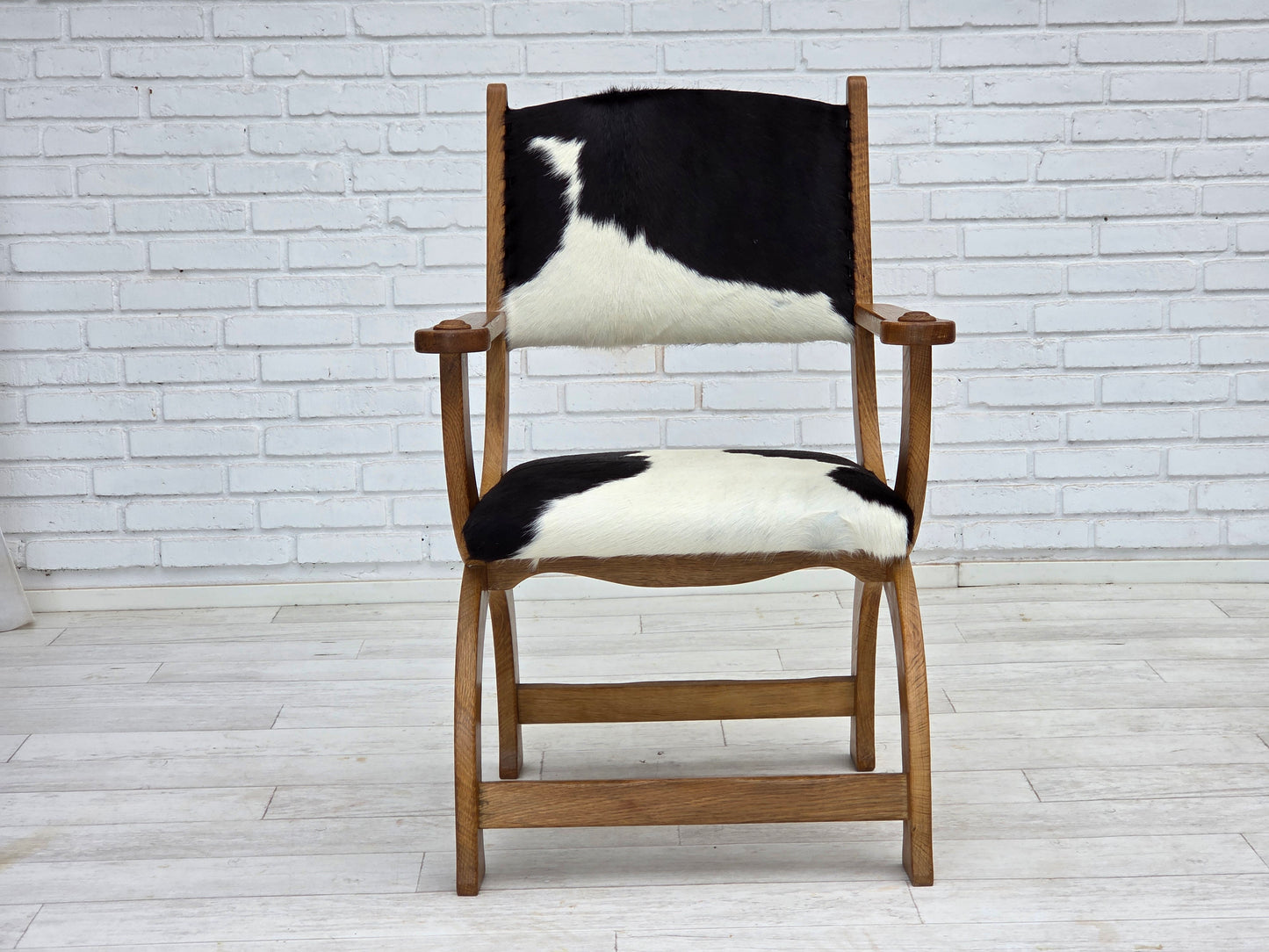 1960s, Danish highback armchair, genuine cowhide, oak wood, reupholstered.