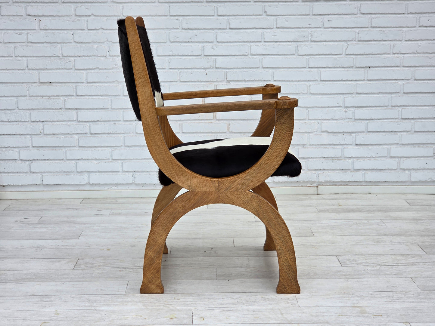 1960s, Danish highback armchair, genuine cowhide, oak wood, reupholstered.