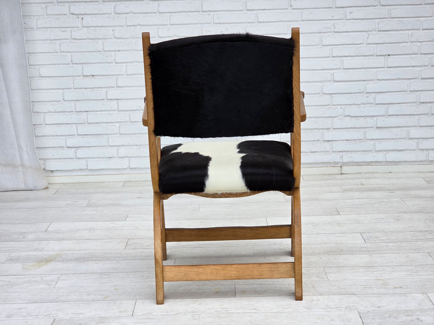 1960s, Danish highback armchair, genuine cowhide, oak wood, reupholstered.