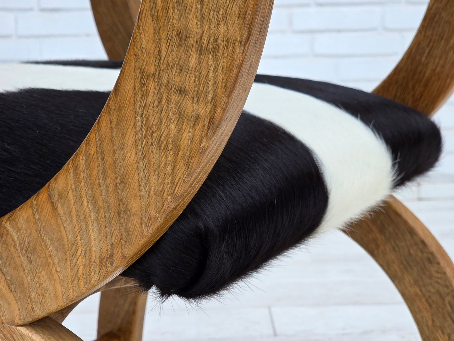 1960s, Danish highback armchair, genuine cowhide, oak wood, reupholstered.