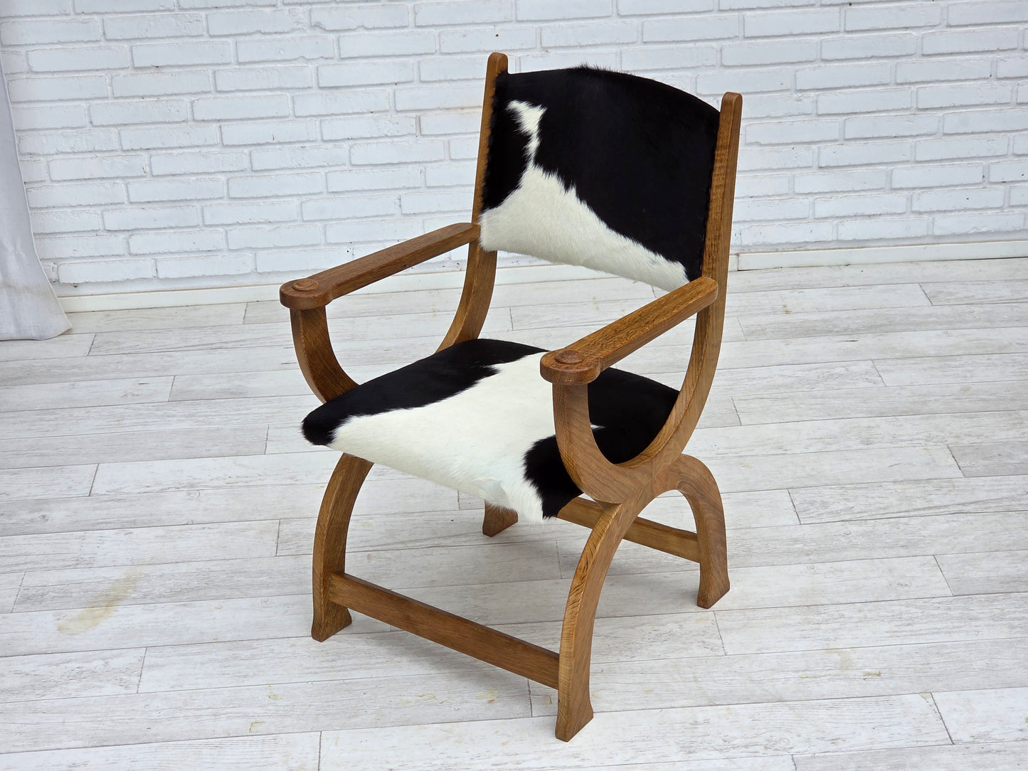 1960s, Danish highback armchair, genuine cowhide, oak wood, reupholstered.