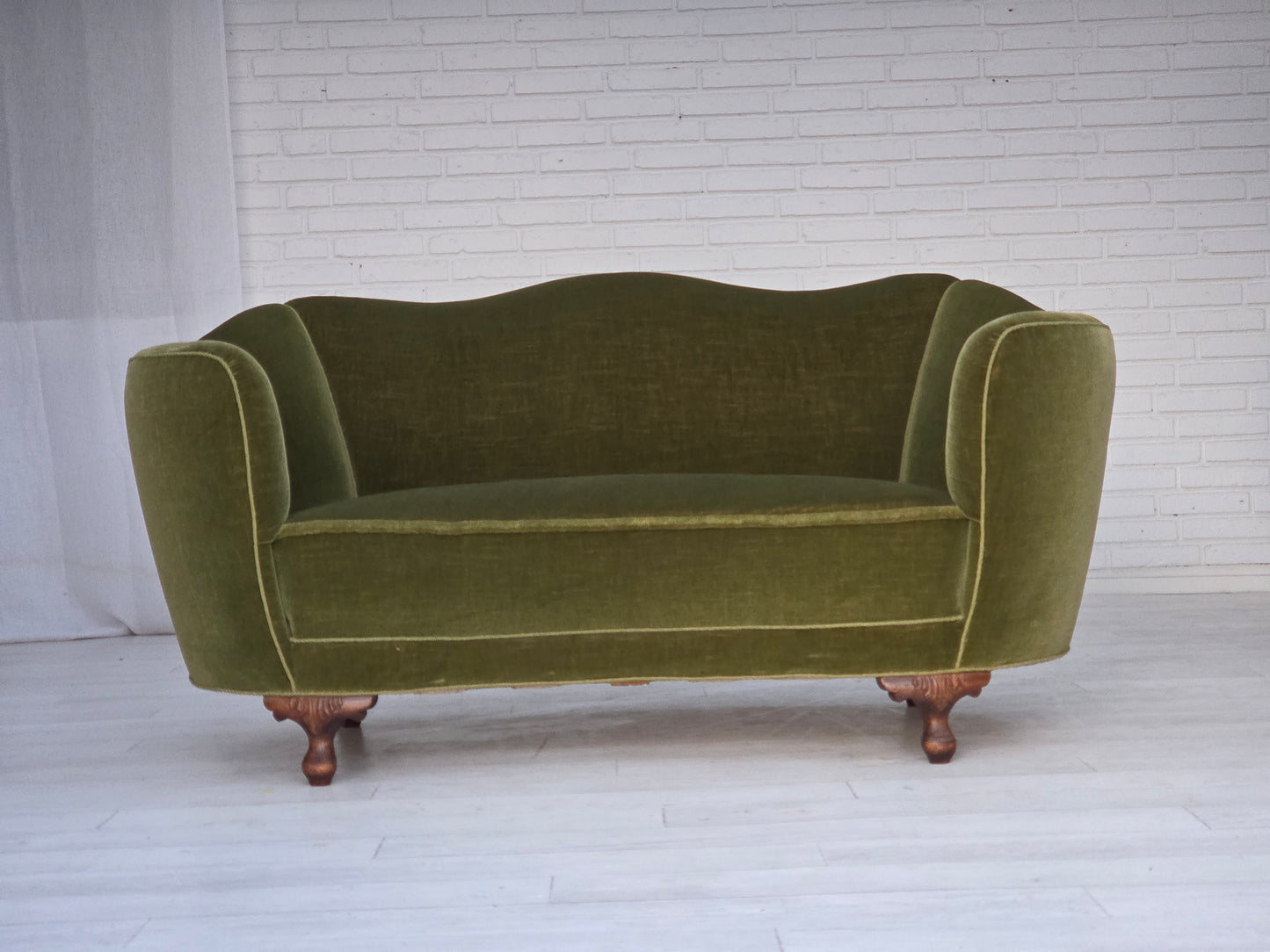 1960s, Danish curved 2-seater sofa, green furniture velour, oak wood legs.