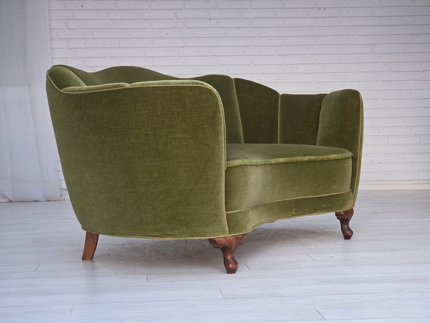 1960s, Danish curved 2-seater sofa, green furniture velour, oak wood legs.