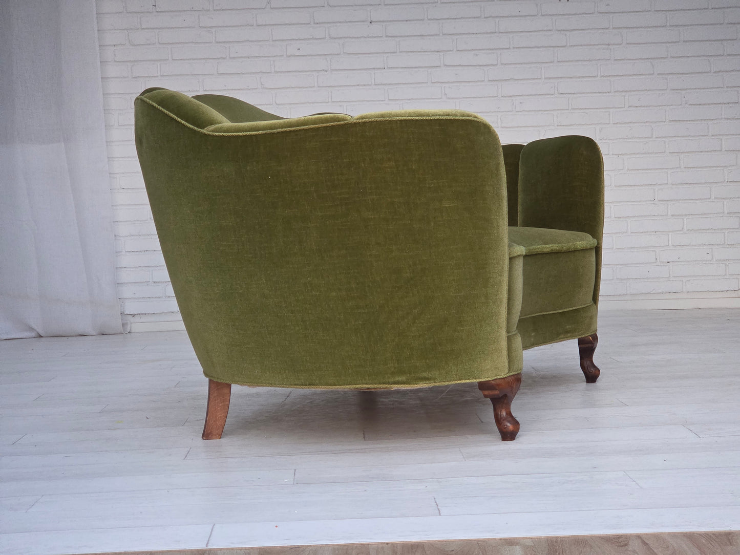 1960s, Danish curved 2-seater sofa, green furniture velour, oak wood legs.