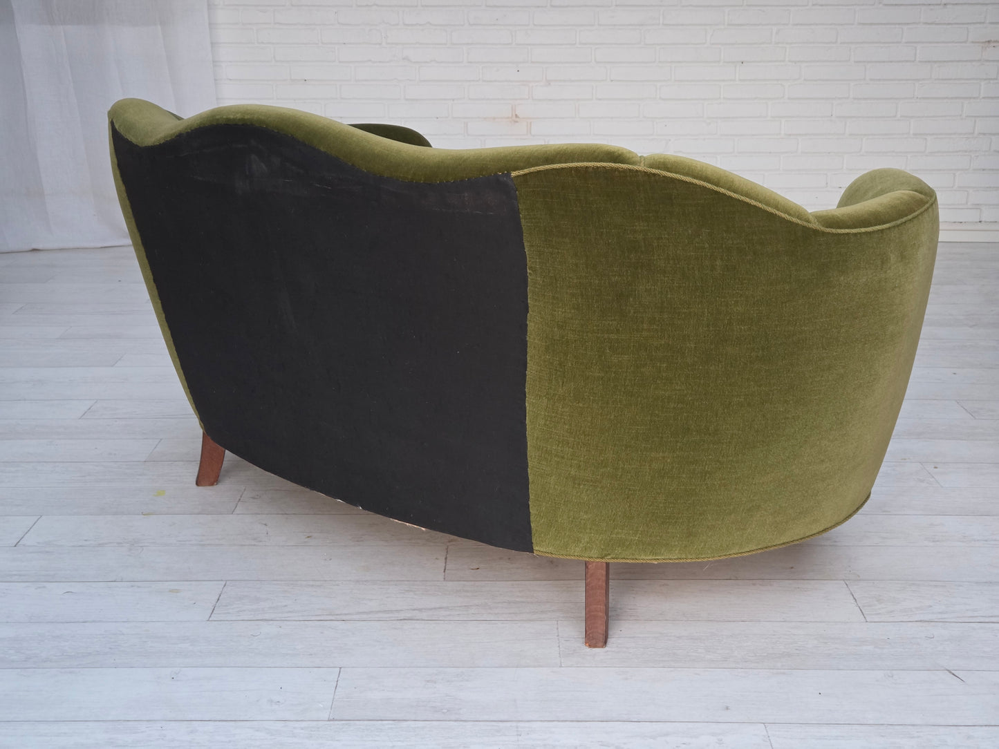1960s, Danish curved 2-seater sofa, green furniture velour, oak wood legs.